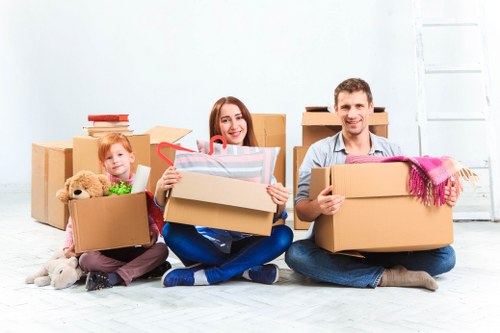 A professional team moving office items through a Dulwich property