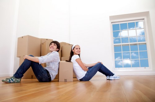 Careful unloading of household items at a Dulwich property on moving day