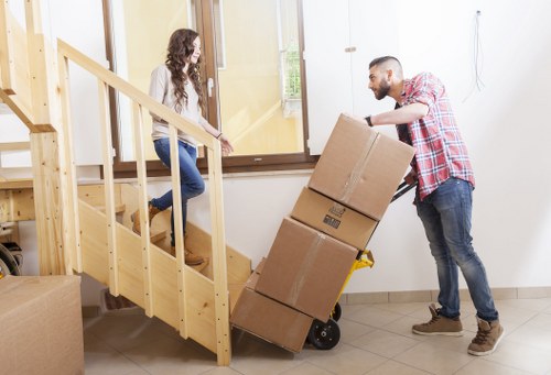 Packed office equipment and furniture ready for a business move